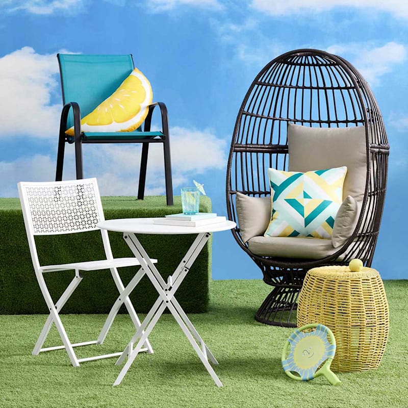 A stackable teal sling patio chair, perfect for outdoor lounging or dining with its comfortable design and vibrant color.