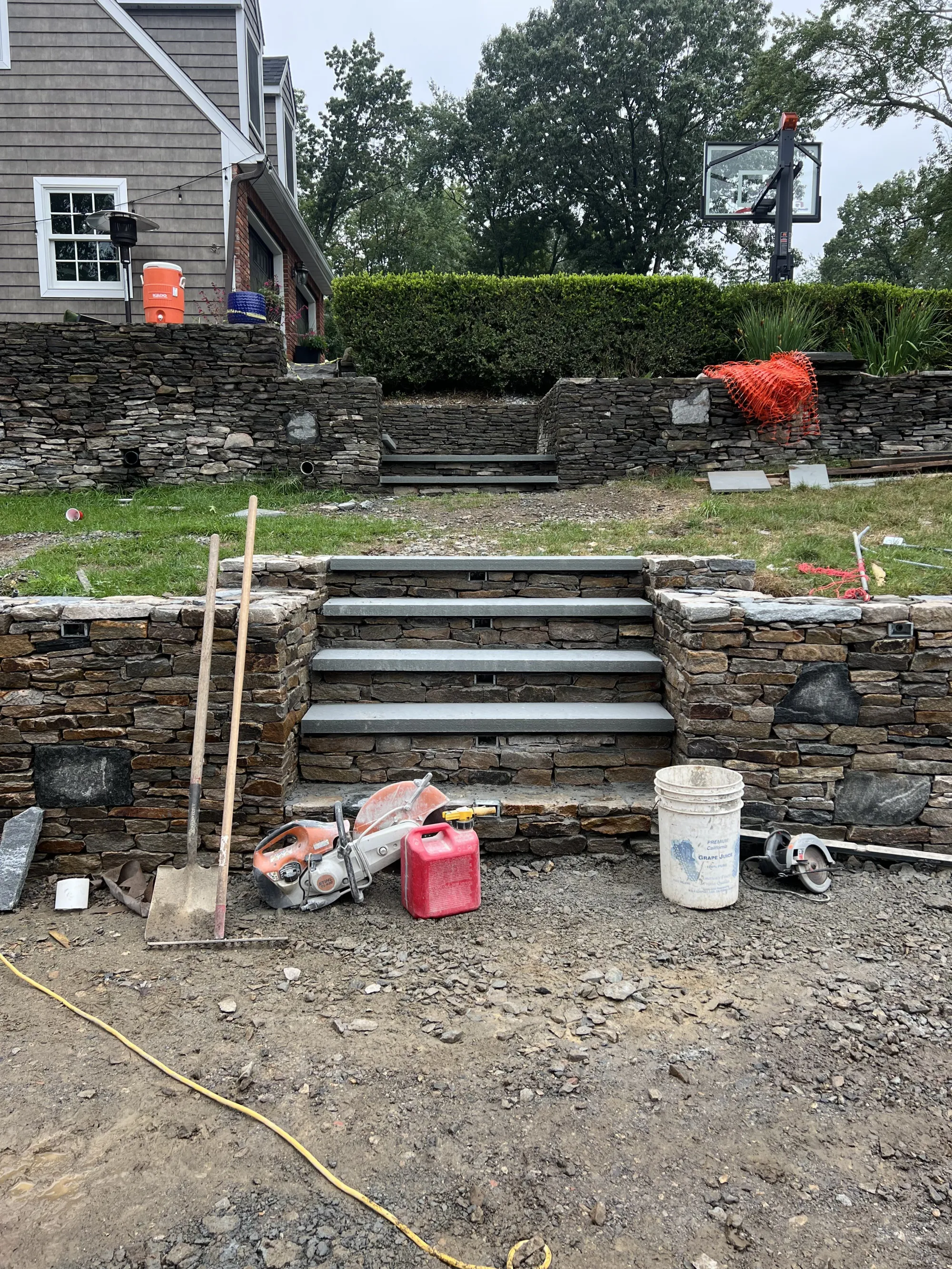 Front entrance stone steps - Steps project by General Masonry LLC.