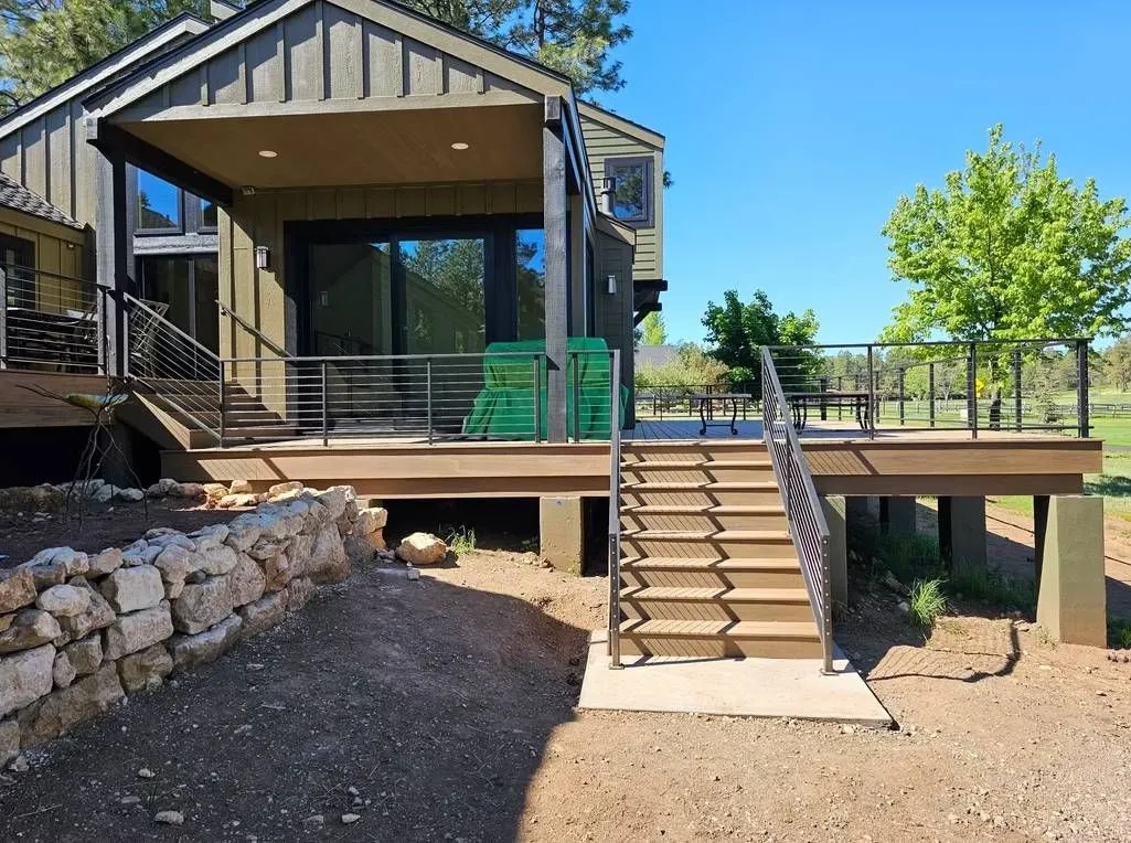 Professionally built elevated deck with composite decking, metal railings, and covered outdoor space. Designed to maximize functionality, durability, and outdoor enjoyment while enhancing overall property value.