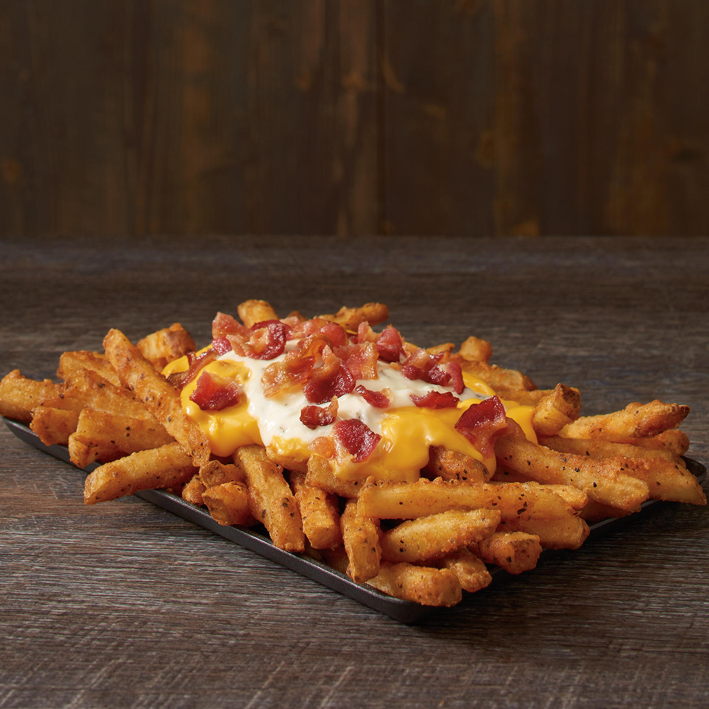 Our Famous Seasoned Fries topped with cheese, ranch and crispy bacon. Checkers Katy (281)574-6696