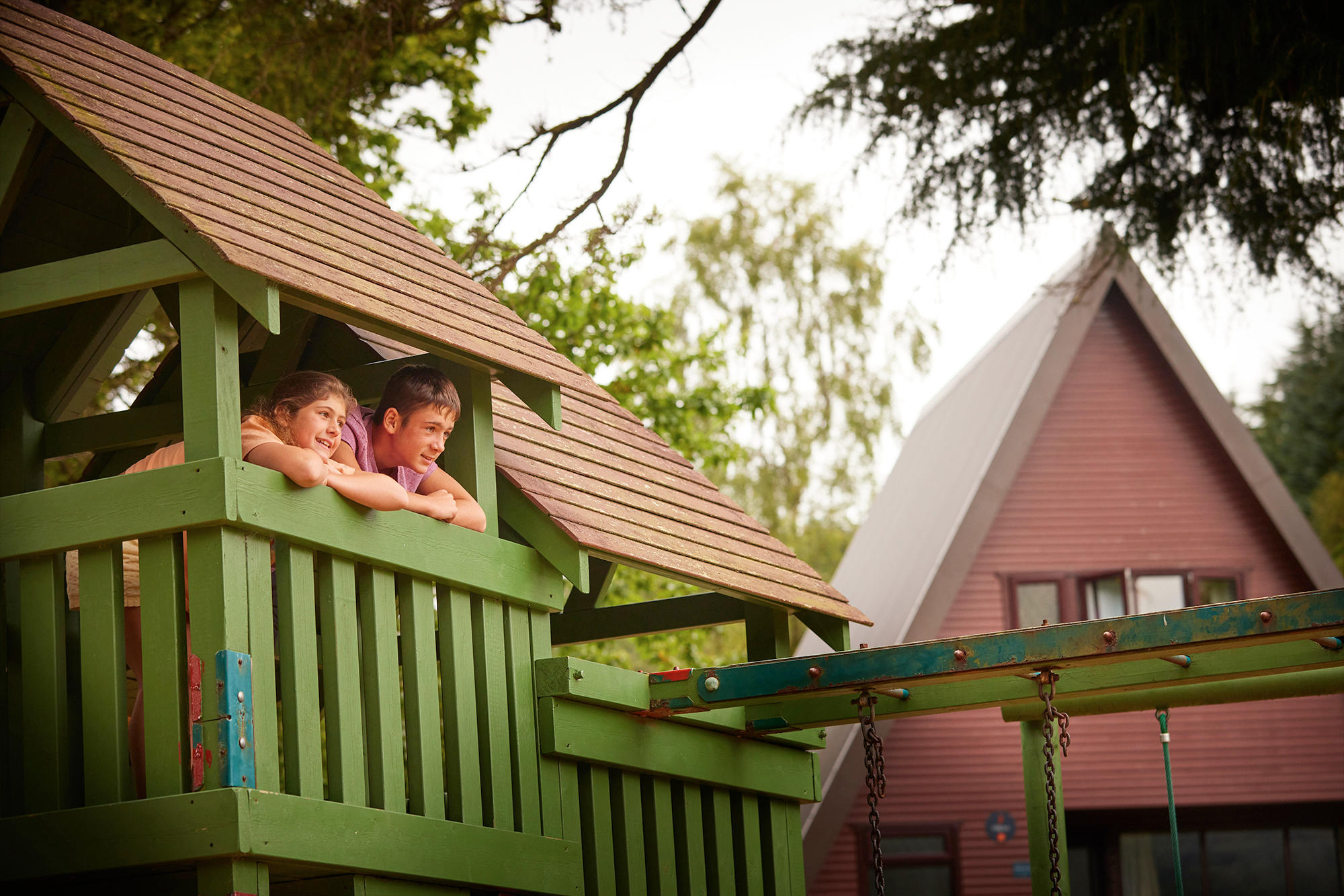 Kids play in the outdoor Play Area at Drimsynie Estate