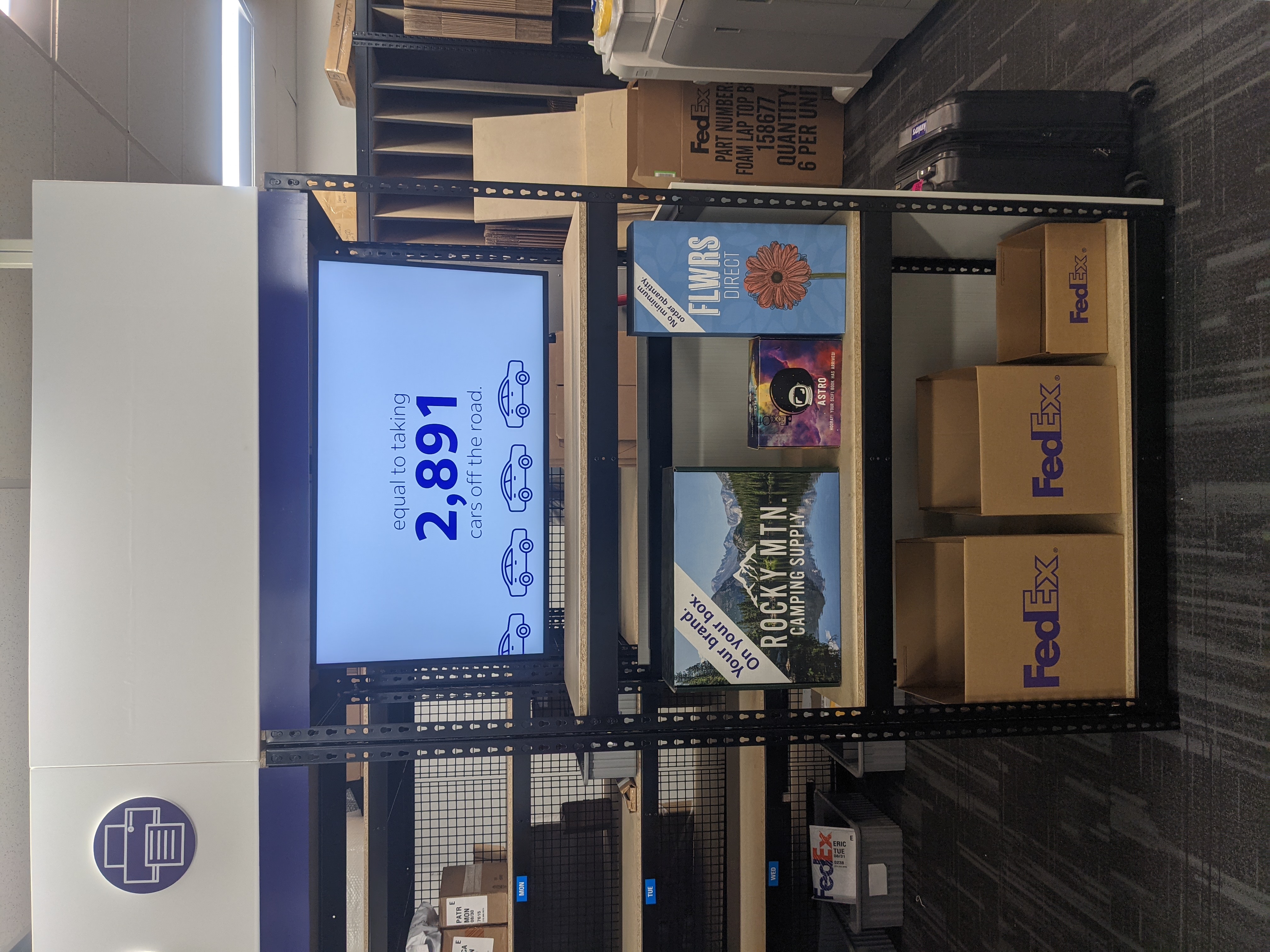 Marketing and Print Display Section &ndash; In-store marketing display featuring signage, business printing, and promotional materials available at FedEx Office NYC.