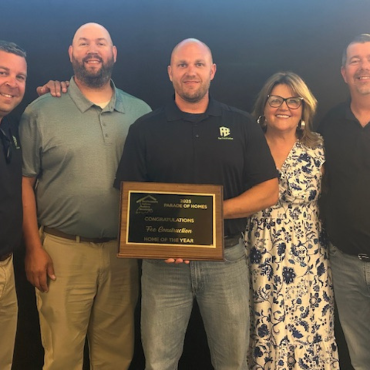 Owner with award