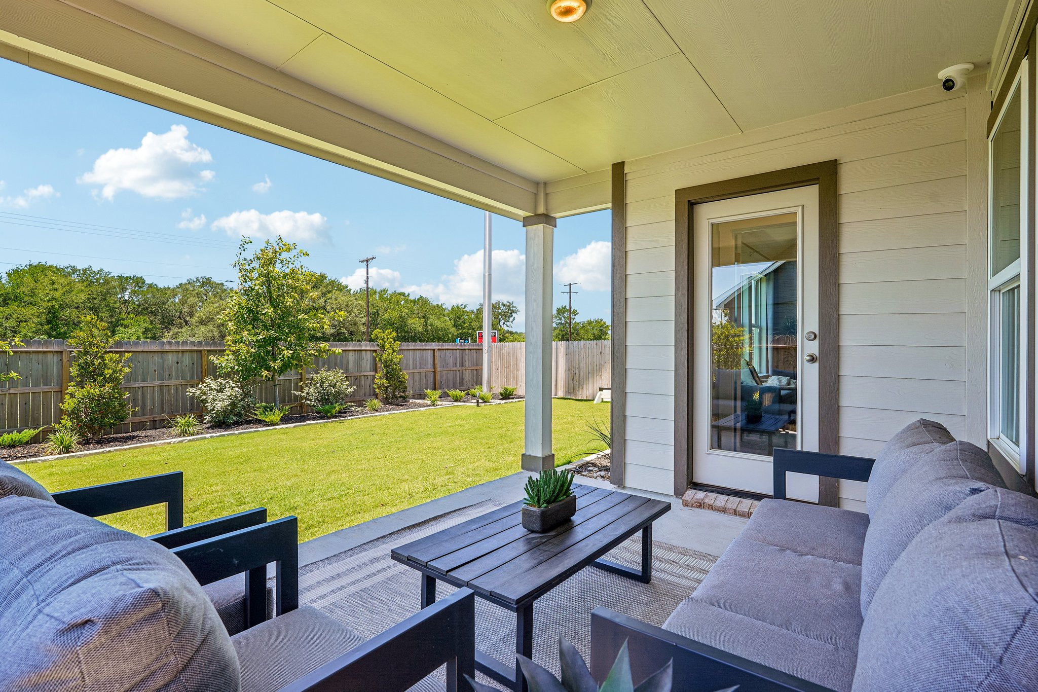 Covered Patio Extends Living Space Outdoors with Generous-Sized Backyard 