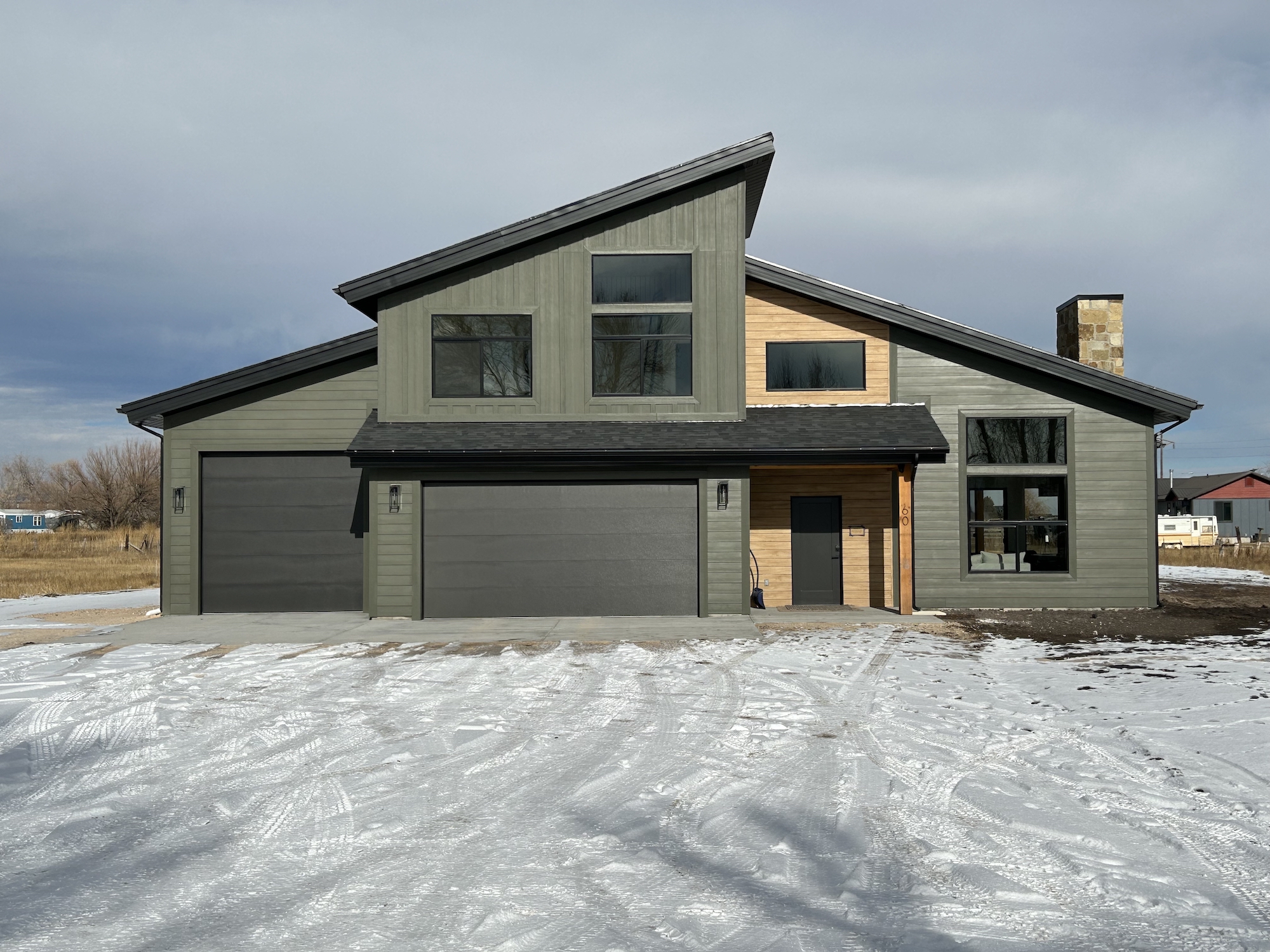 Large green home after exterior services in Logan