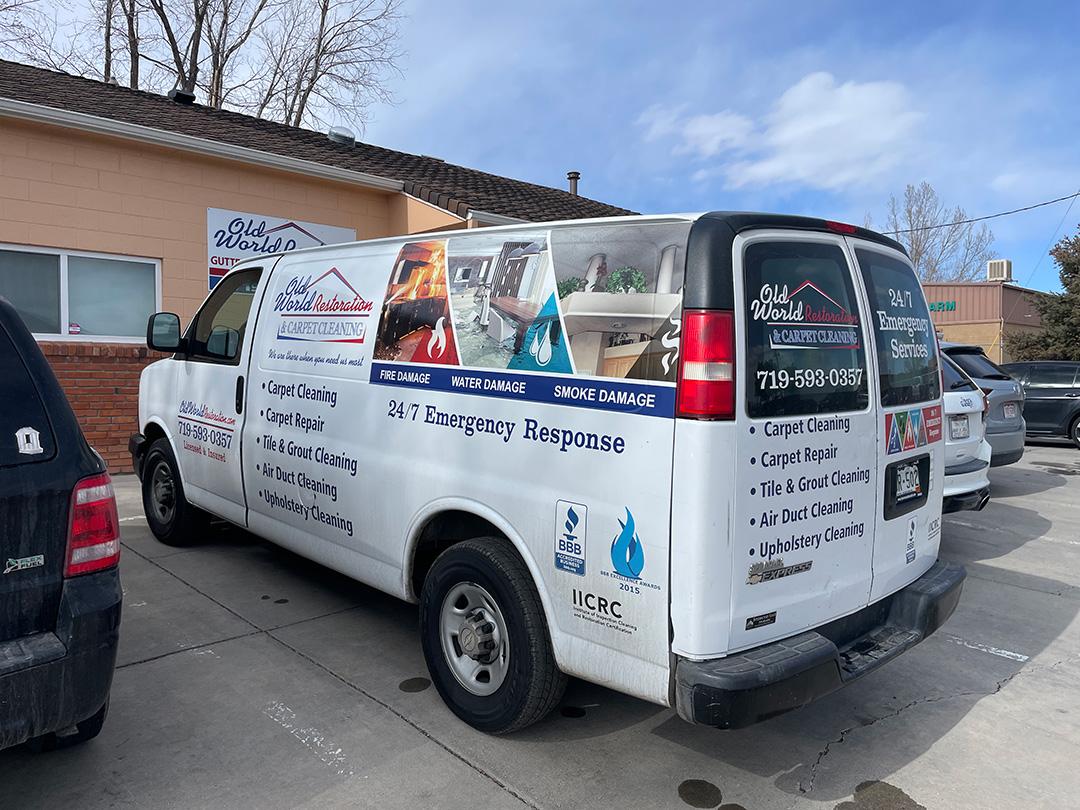 Old World Restoration and Carpet Cleaning van out front of the office