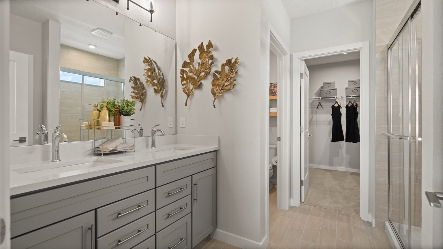 The Jupiter Model Home Primary En Suite Bath at Grasslands West by DRB Homes