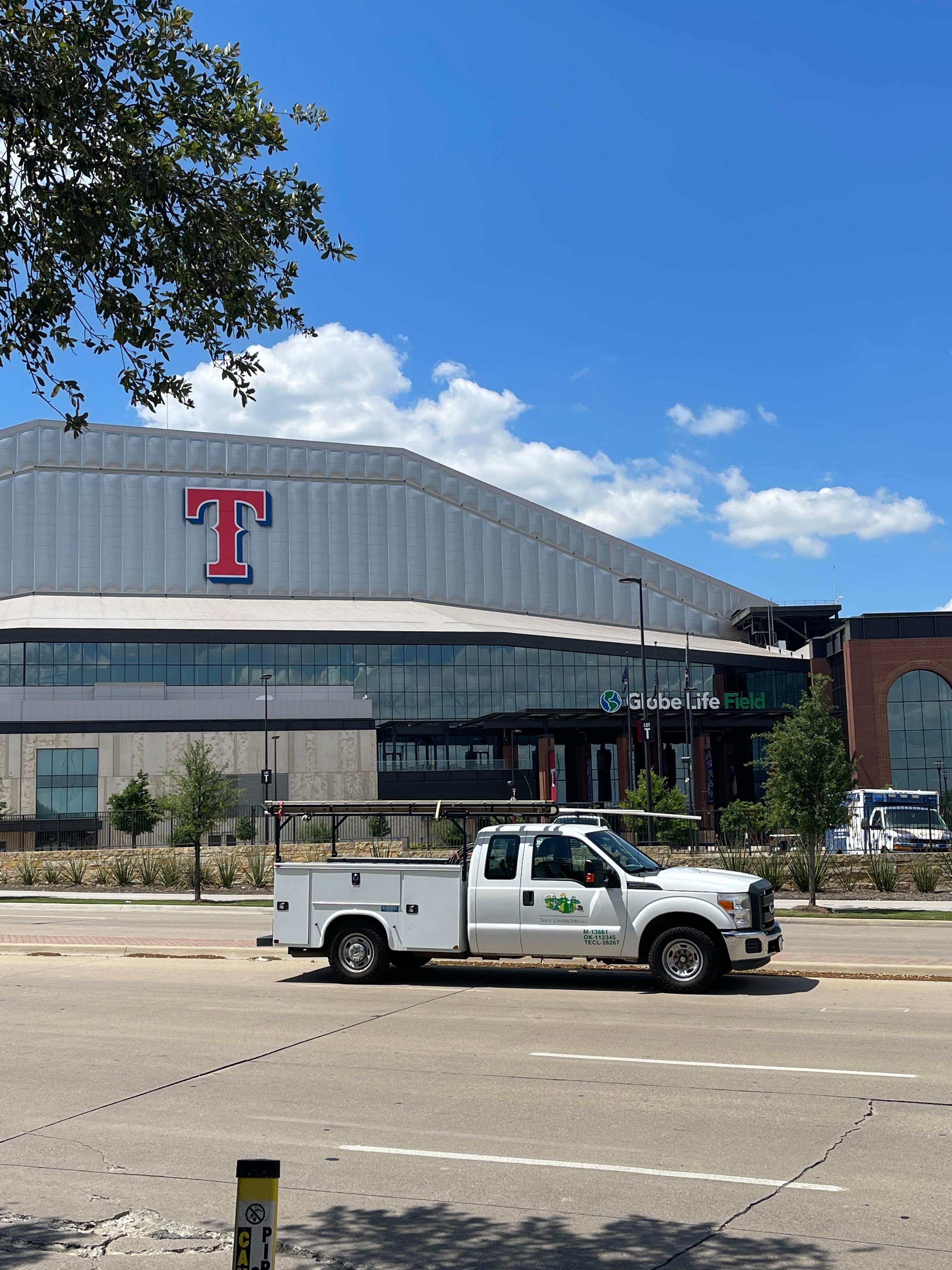 The Globe Life Field building and a Tioga service truck in Arlington Texas.