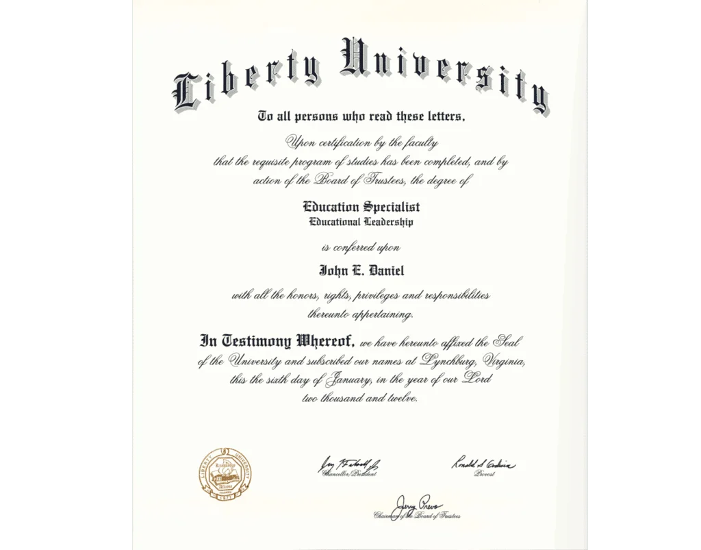 A diploma from Liberty University is shown, featuring decorative script text. The diploma confirms that John E. Daniel has been awarded the degree of Education Specialist in Educational Leadership. The document is dated January 6, 2012, and includes seals and signatures from university officials.