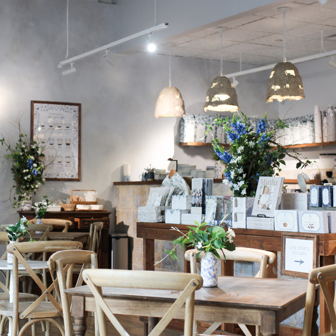 The bright interior of maman Park Cities combines warm wood furnishings, artisan retail products, fr 