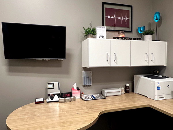 Interior photo of the hearing consultation room for AudioNova hearing clinic in Leesburg, FL