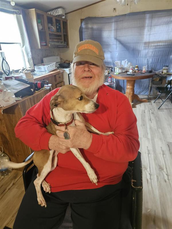 Older adult enjoying companionship and comfort at home with support from care services.