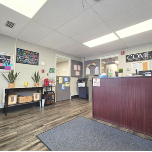 Bright and colorful preschool classroom at Childcare Network with age-appropriate learning materials