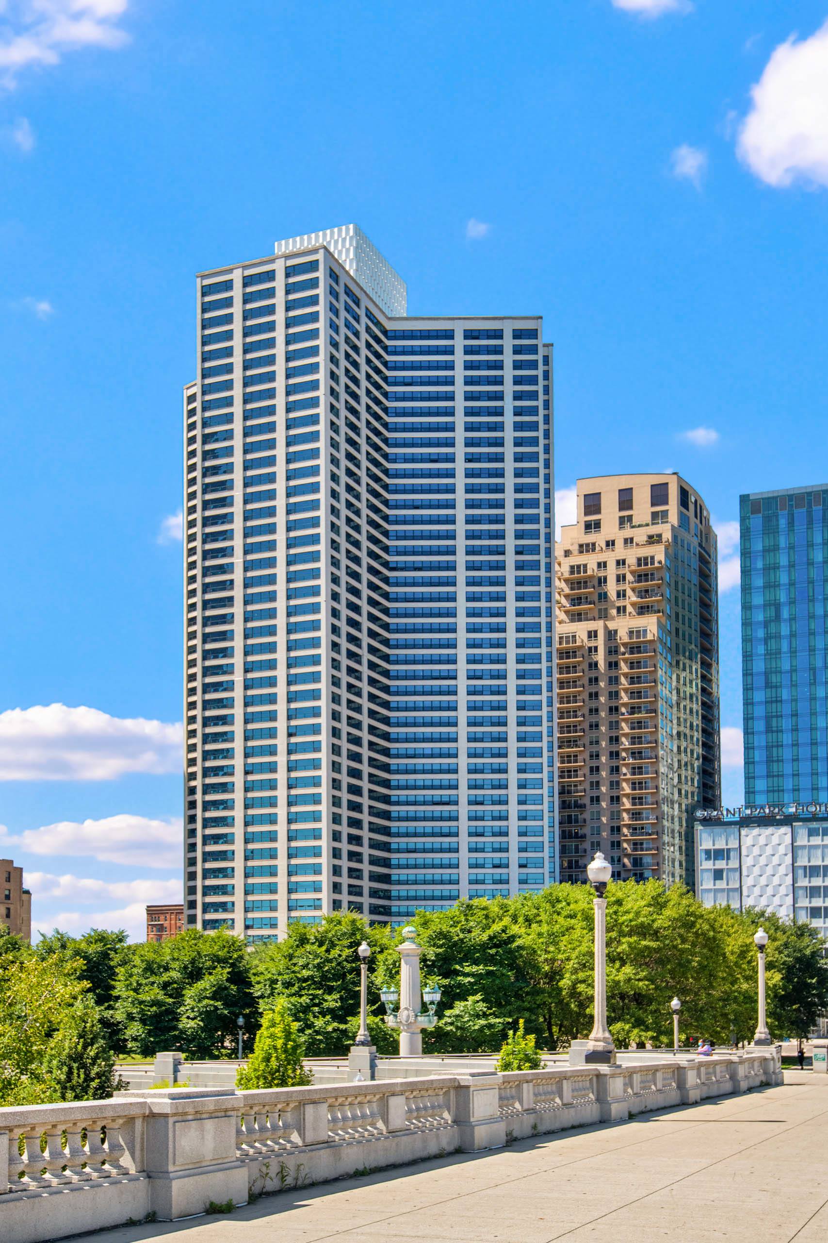Modern high rise building with landscaped park setting 