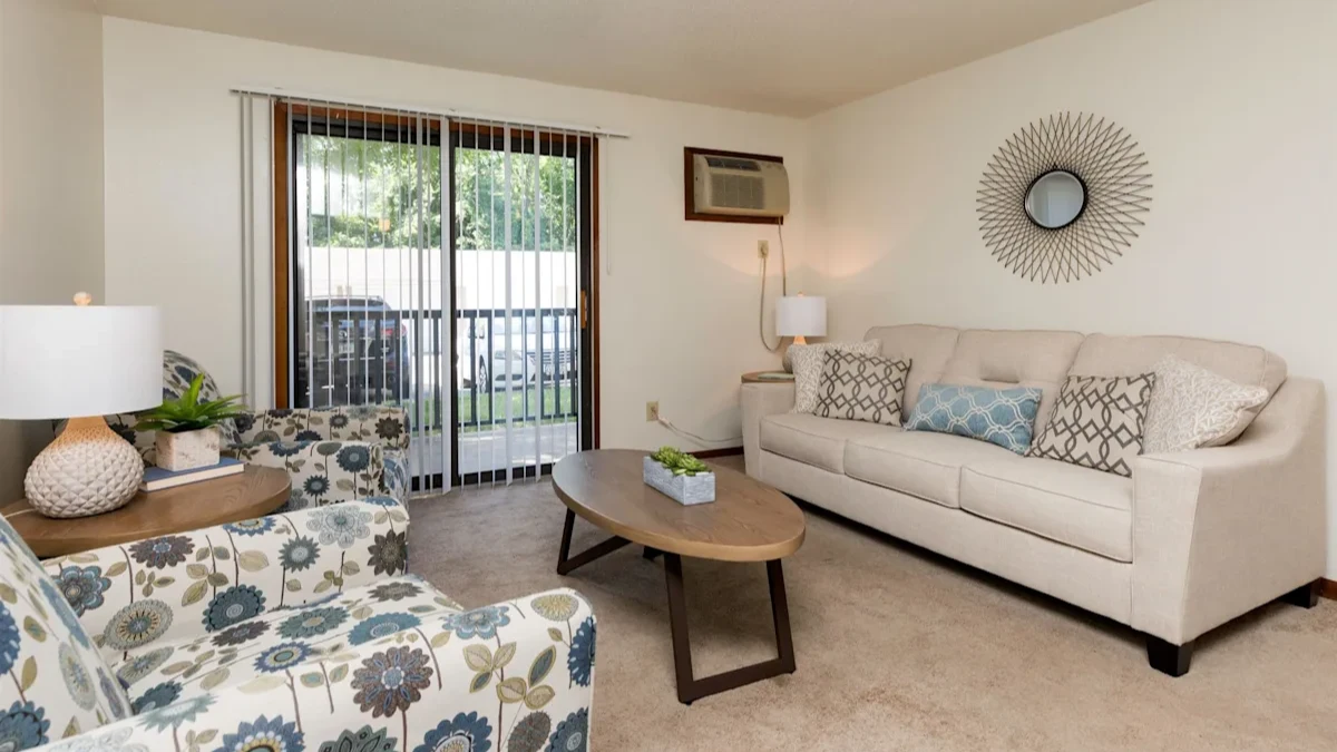 a living room with a couch and a chair and a sliding glass door