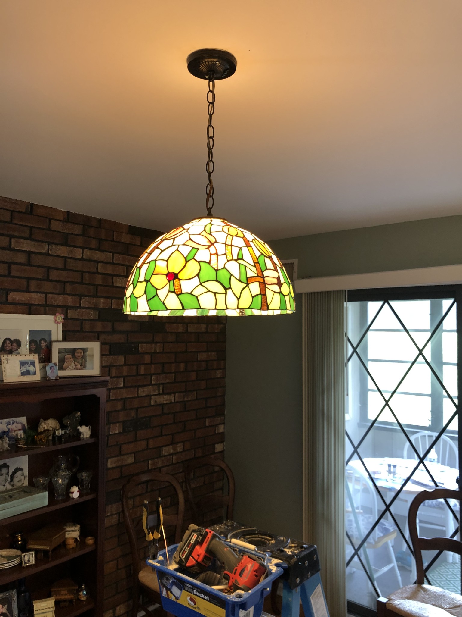 Removed the existing fixture and installed this beautiful Tiffany glass fixture made by Electrical Lamps Plus.