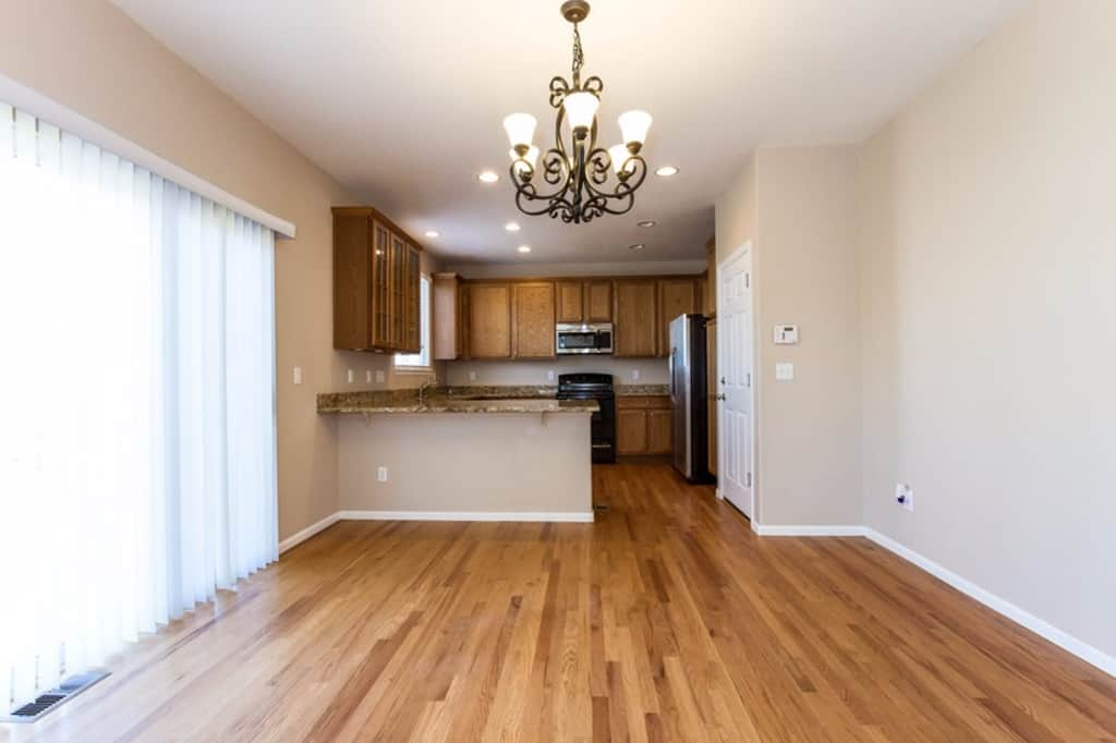 Kitchen with stainless-steel appliances and granite countertops at Invitation Homes Denver.