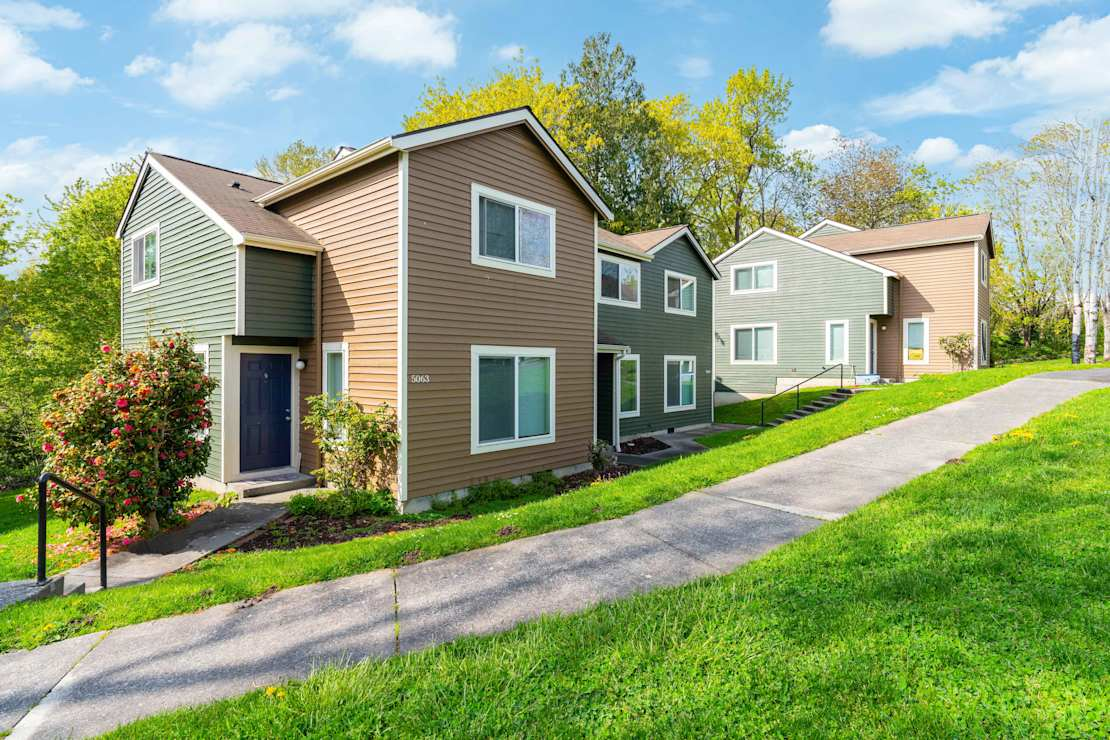 Exterior of apartment building and green grass