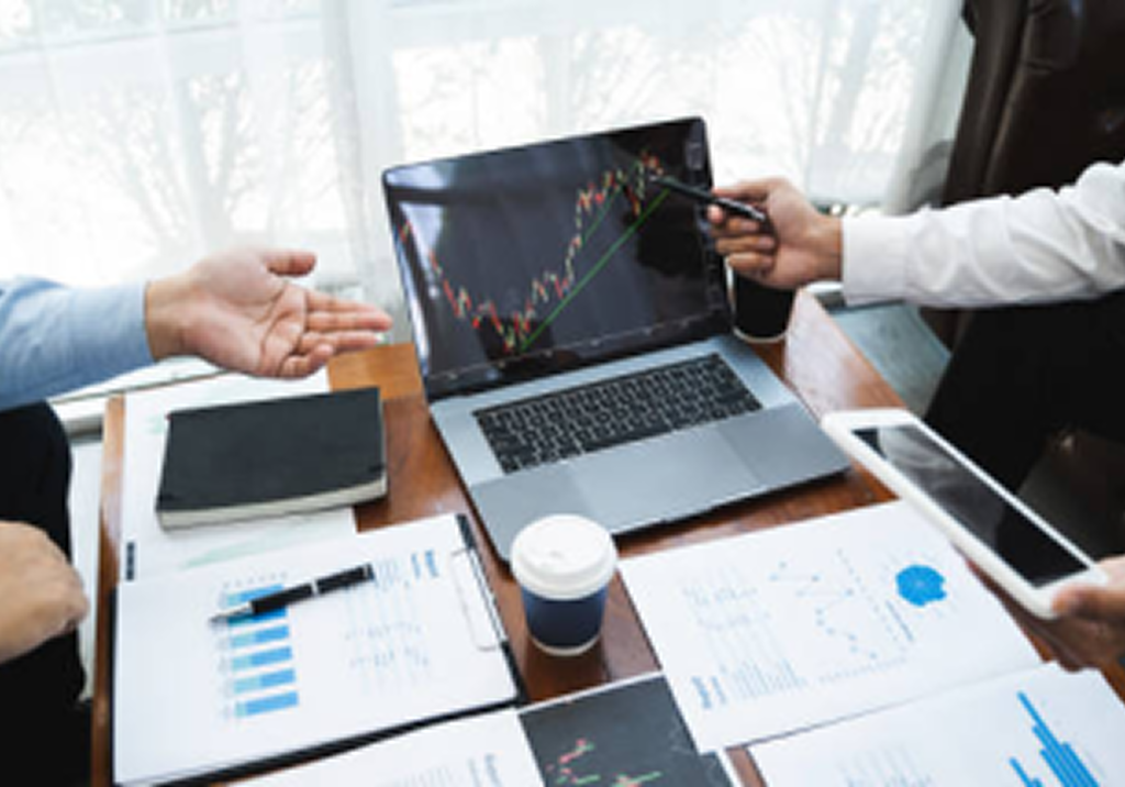 Close up of wealth professionals working together in an office.