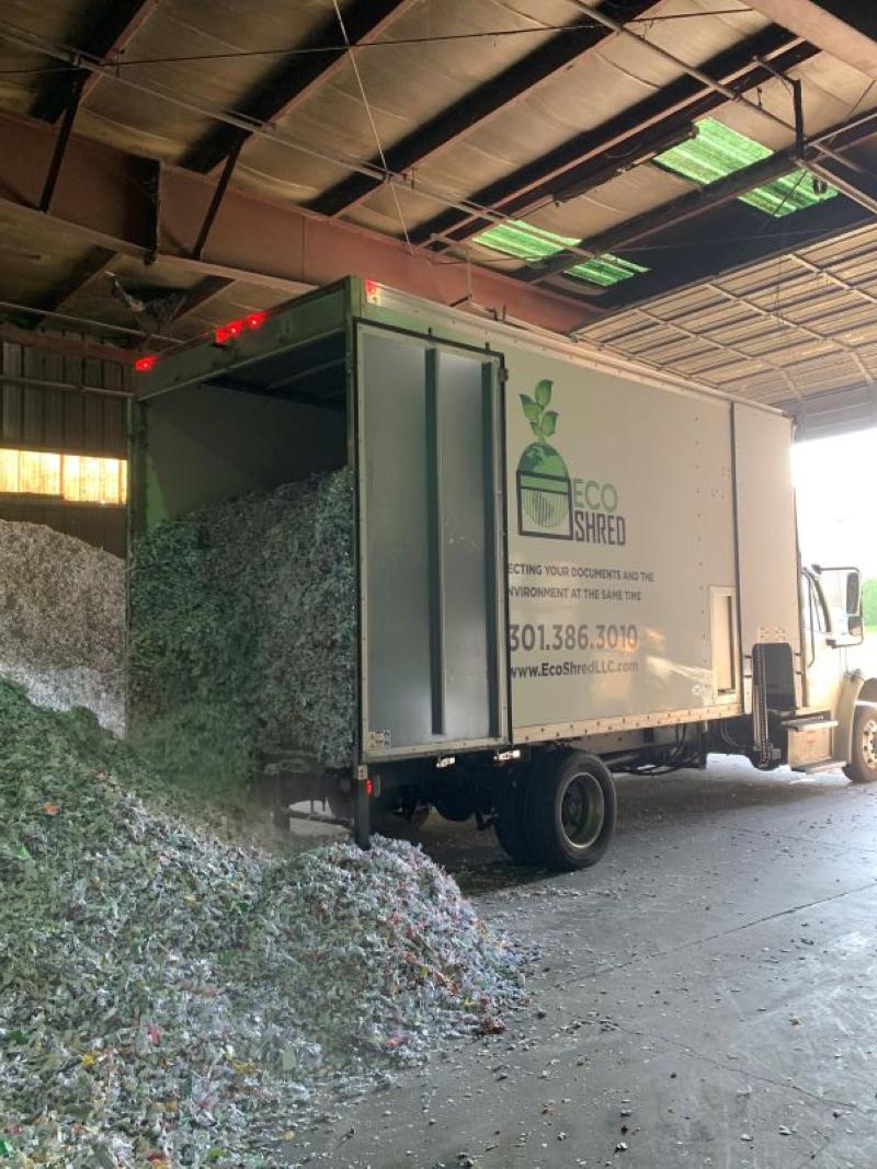 Eco-Shred dumping shredded paper for baling and recycling. We provide on-site mobile and off-site shredding services in Maryland, Virginia, and Washington, D.C.