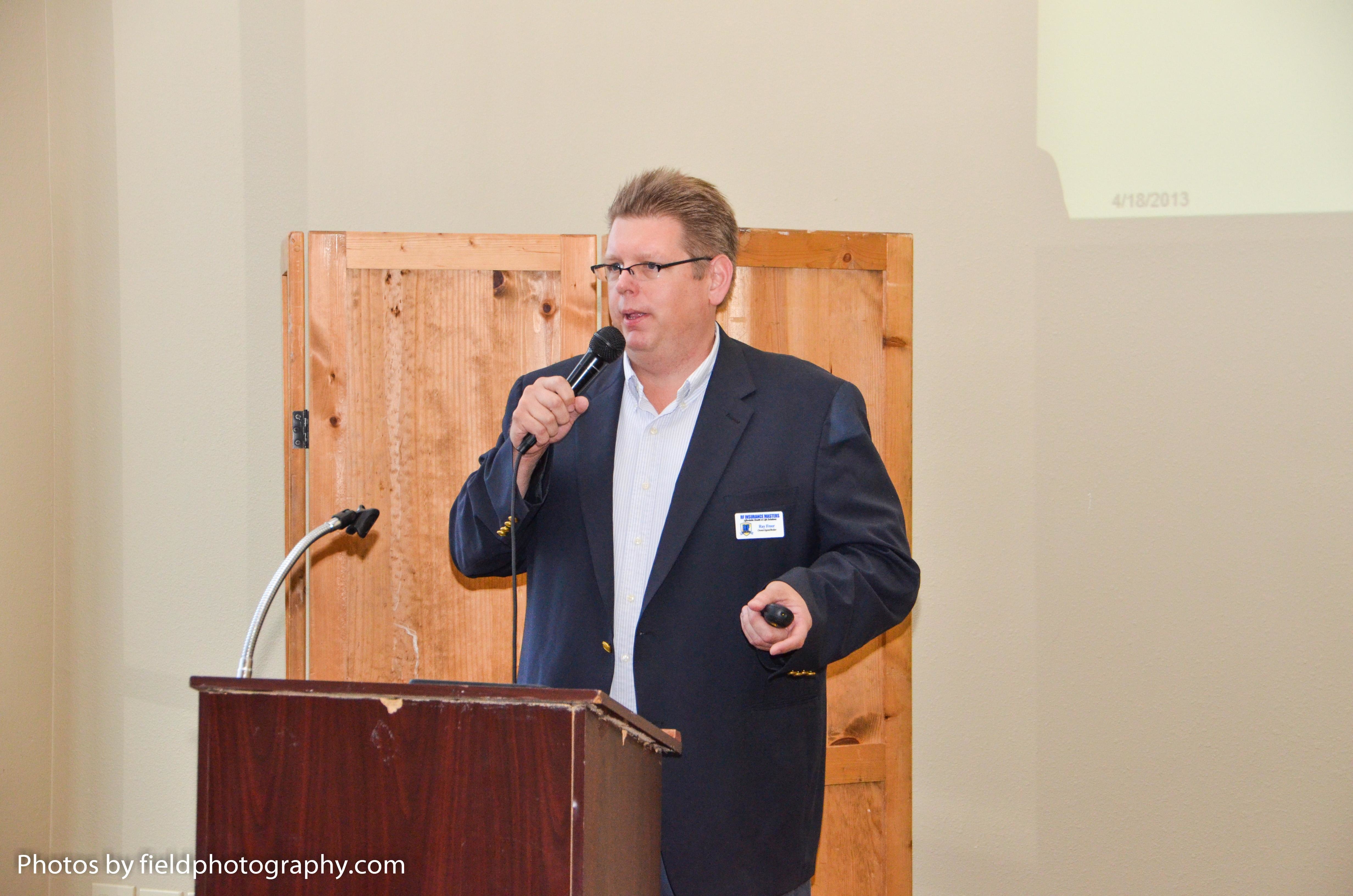 Addressing the Four Points Chamber of Commerce Luncheon in May 2013 at River Place Country Club.