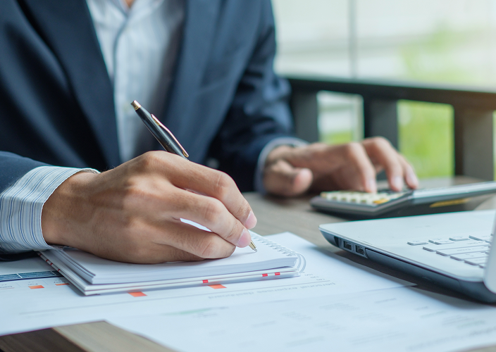 Close-up of a business owner reviewing documents.