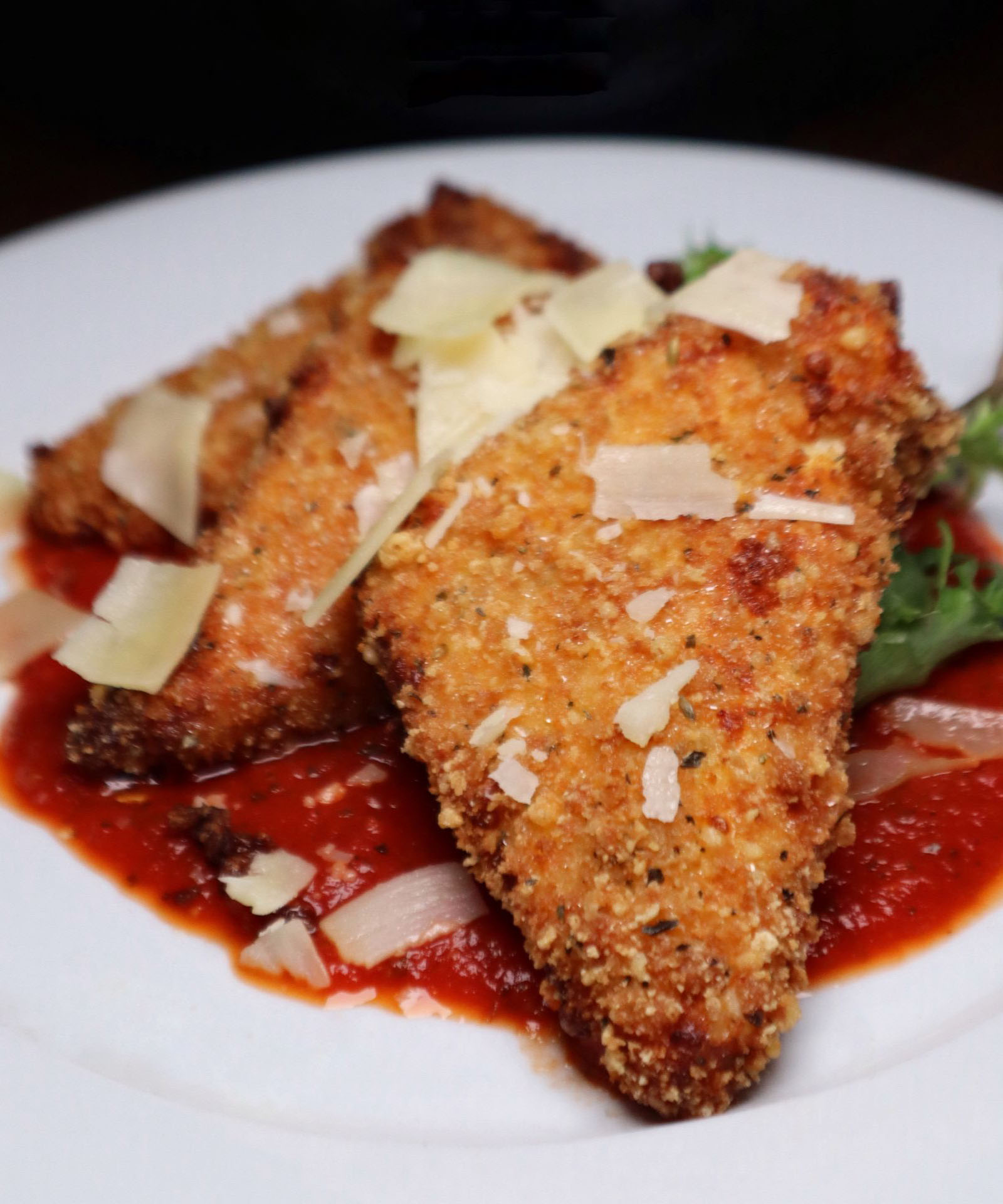 Parmesan crusted, house marinara, mixed greens