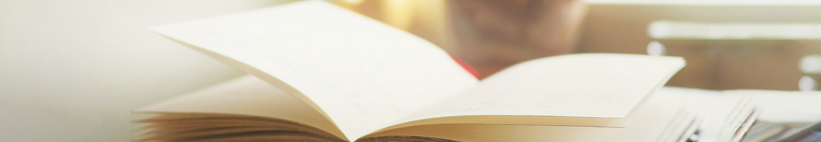 A notebook laid flat on a desk.