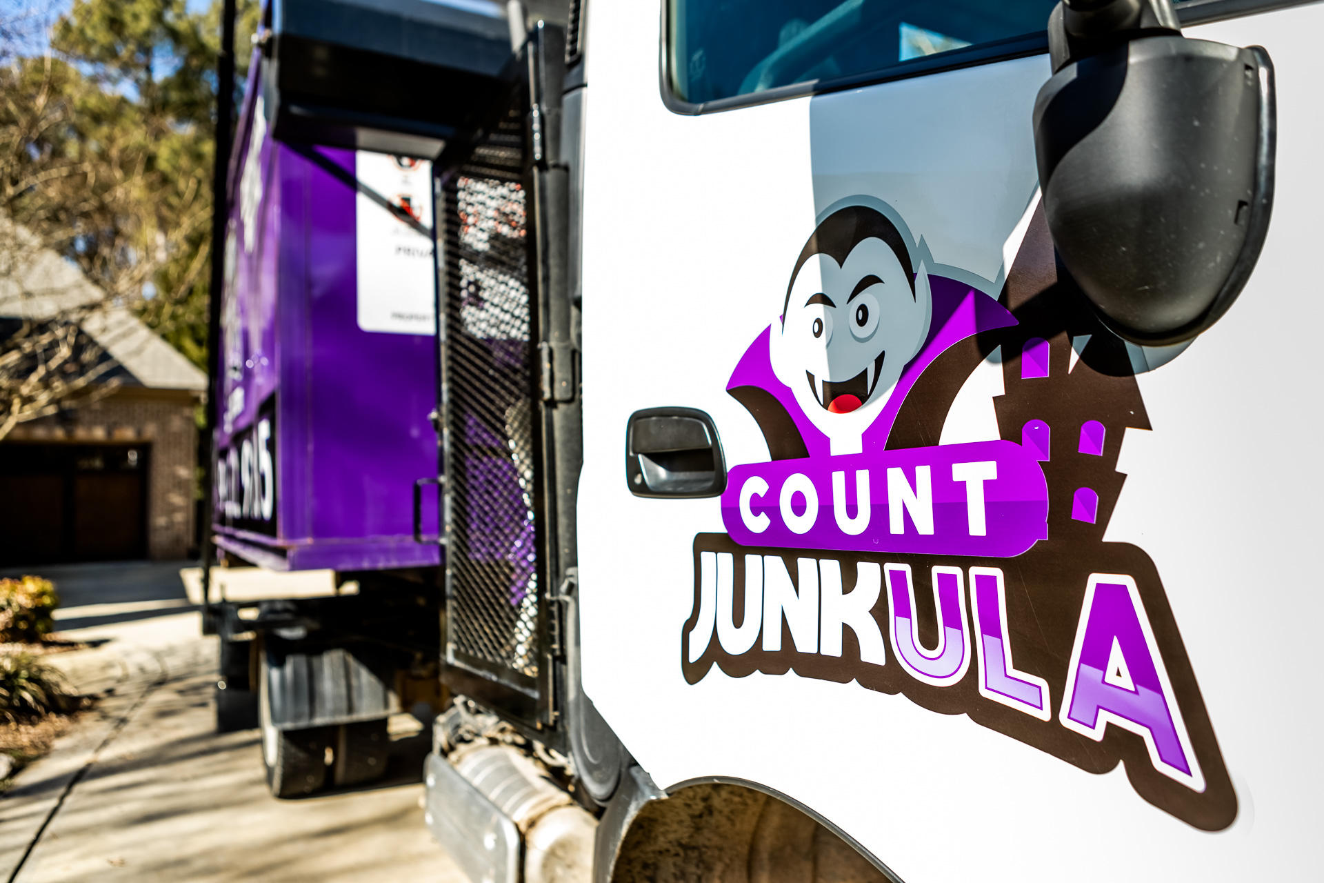 count junkula of raleigh junk removal dumpster logo shot white