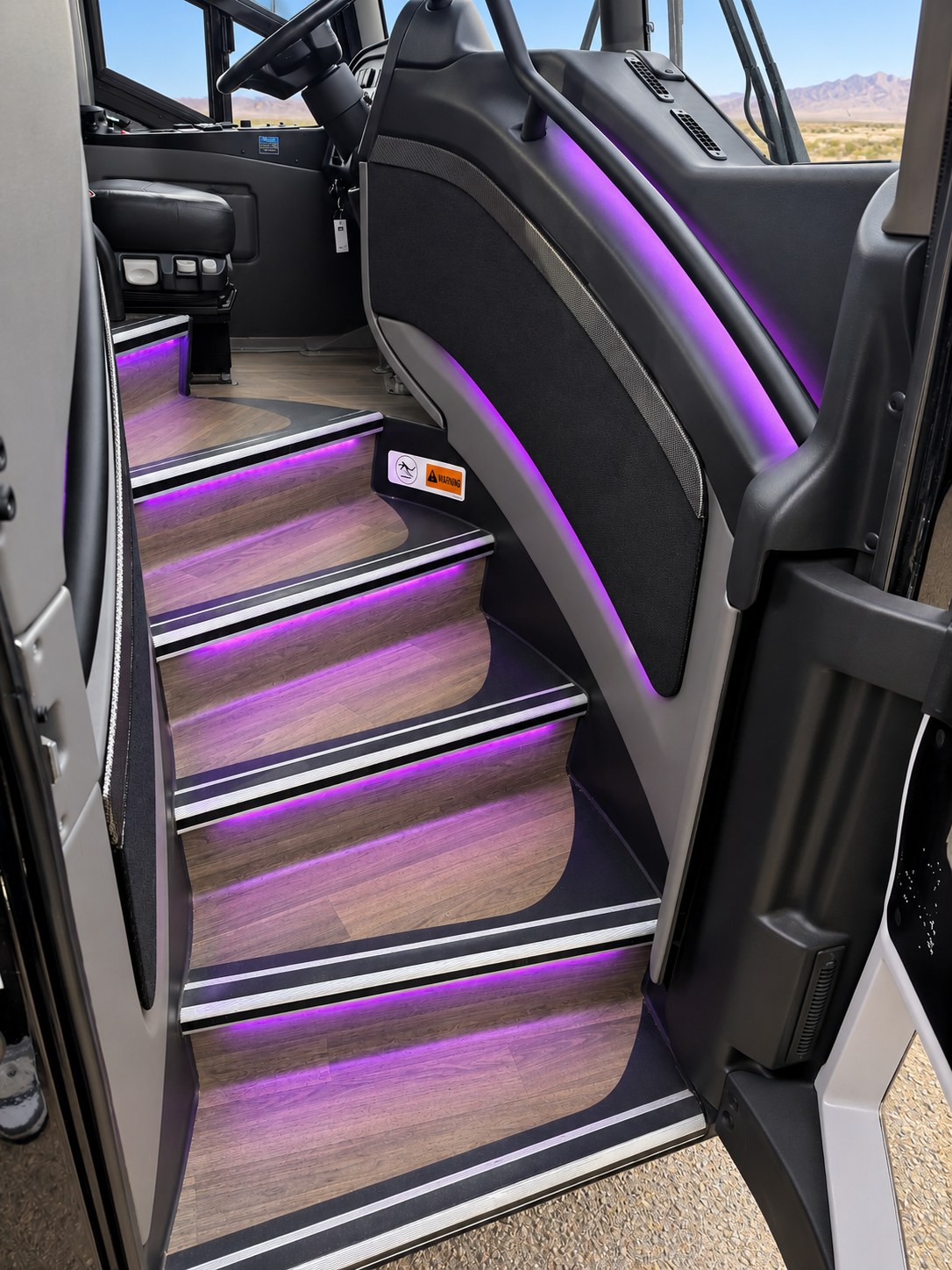 Illuminated shuttle entrance steps designed for safer passenger boarding.
