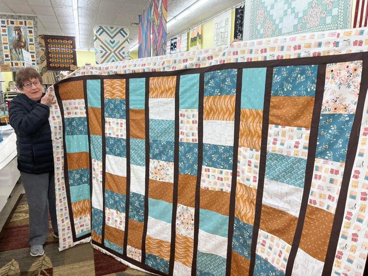 Saturday Show and Tell by Judy! We love this quilt by Bookish fabrics.