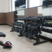 State-of-the-art weight training area featuring comprehensive dumbbell racks and professional-grade equipment. Our fully-equipped strength training zone supports everything from rehabilitation to athletic performance goals.