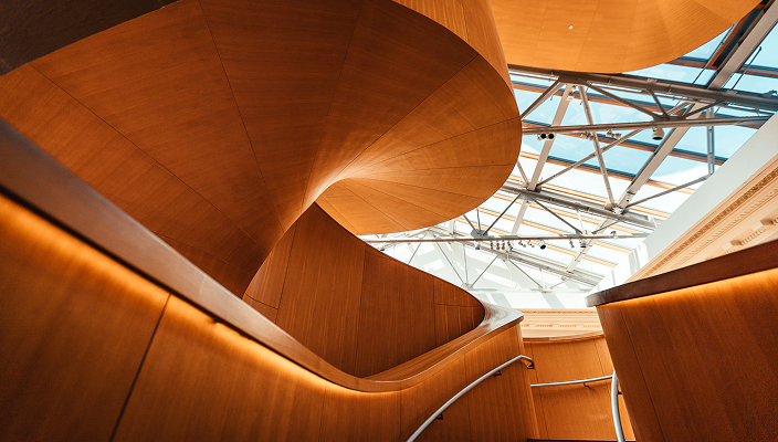 Gorgeous wooden spiral staircase.