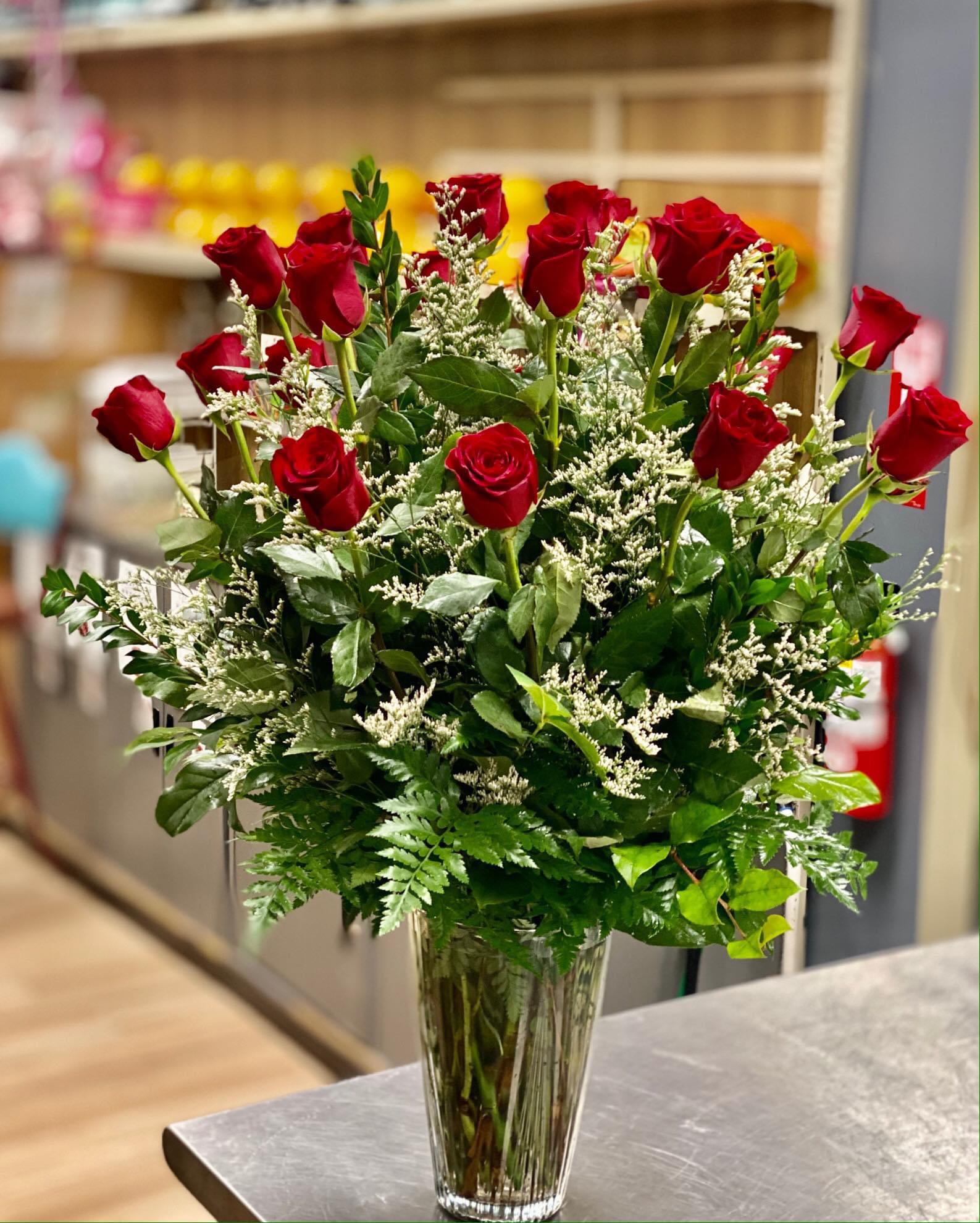 2 DZ Red Roses in a Vase accented with White Limonium