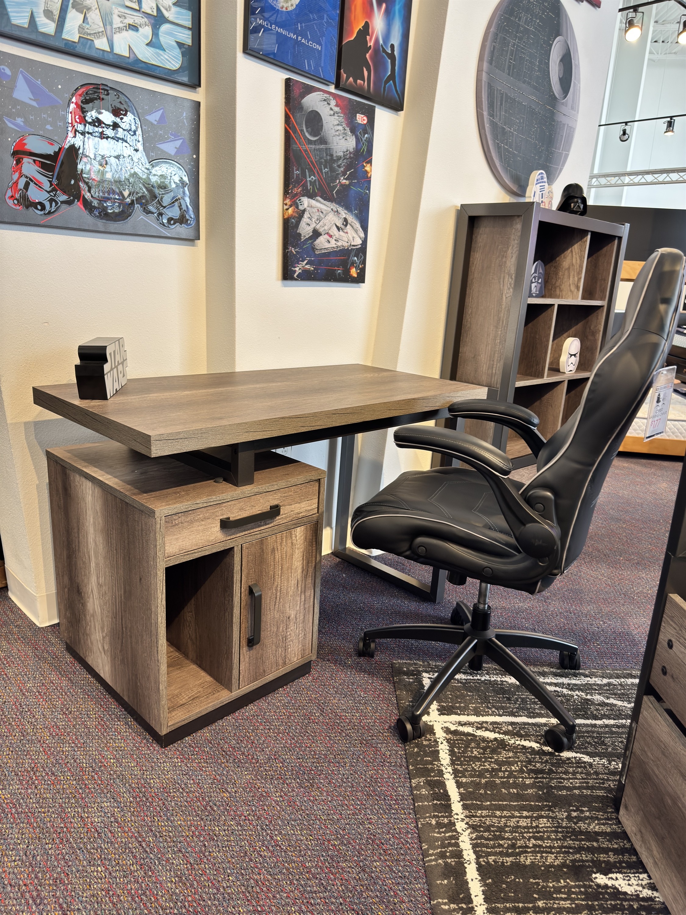 See the gray wood kids desk and black gaming chair set, styled with Star Wars decor and cubby storage.