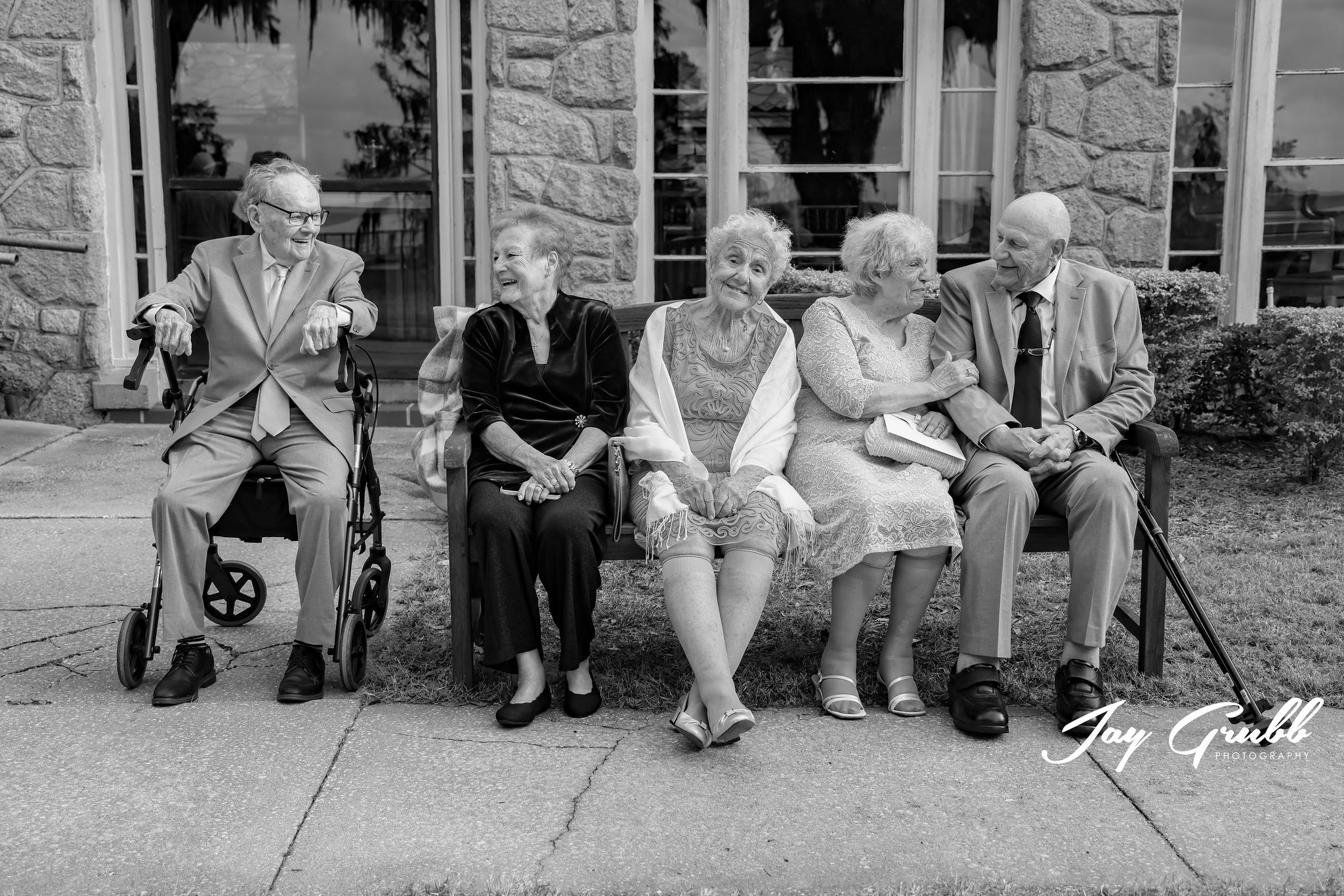 grandparents on bench after wedding ceremony 