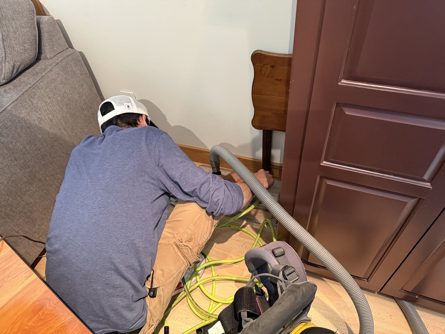 Upfront Home Inspection & Maintenance technician performing residential ventilation cleaning using specialized equipment. Based in New Gloucester, Maine, Upfront provides professional air duct cleaning, dryer vent cleaning, and preventative home maintenance services throughout Southern and Central Maine.
