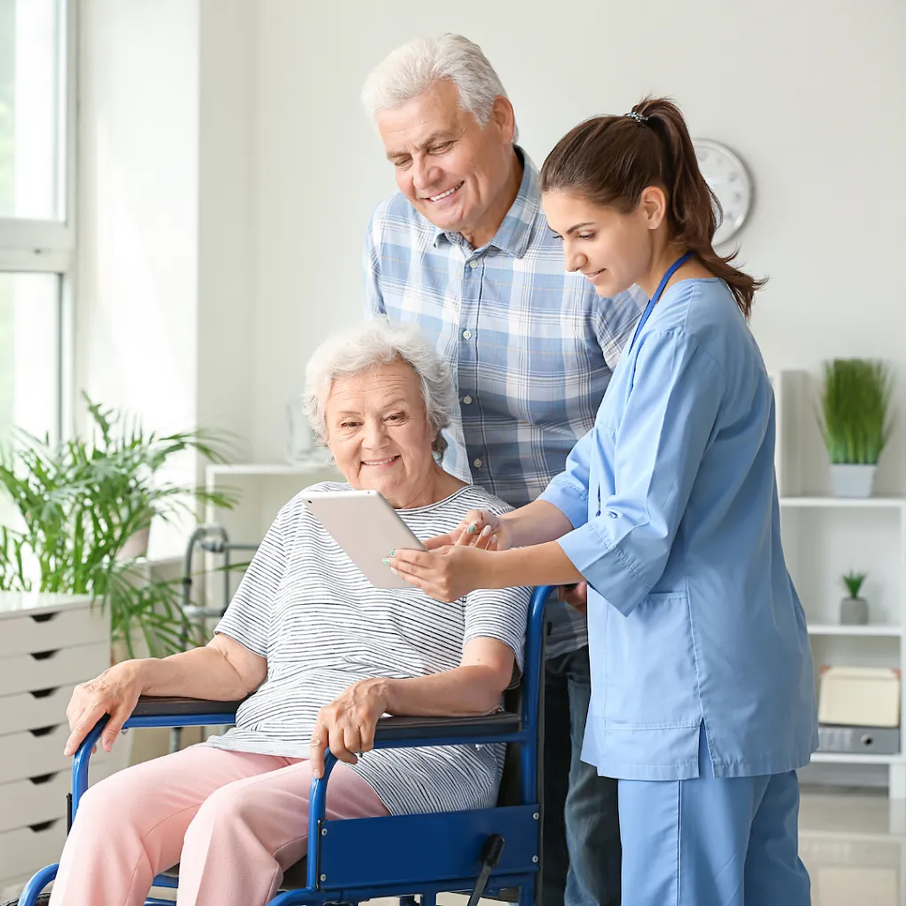 Senior patient with caregiver and nurse.