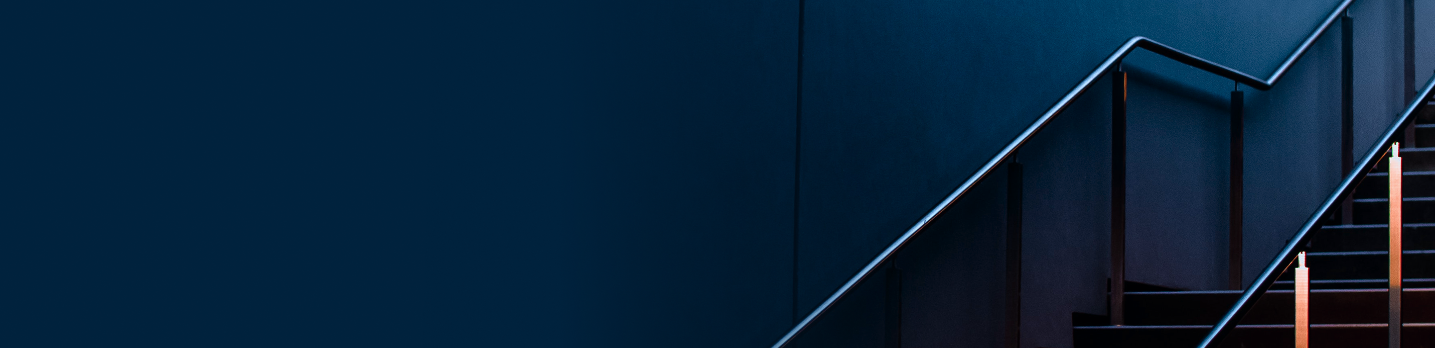 A beautiful, well-lit blue staircase.