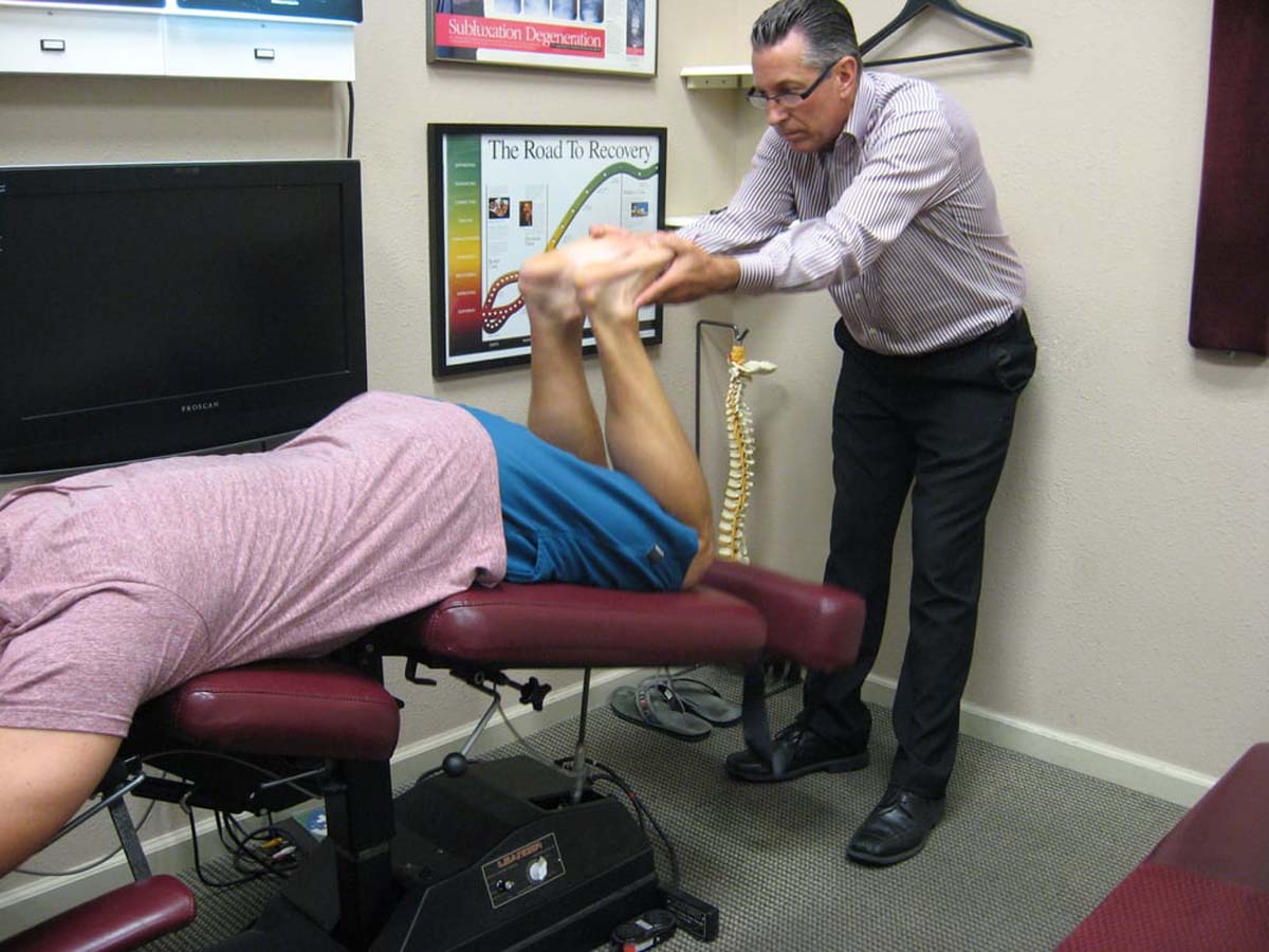 Dr. Pontious checking a patient's alignment on the Leander Table.