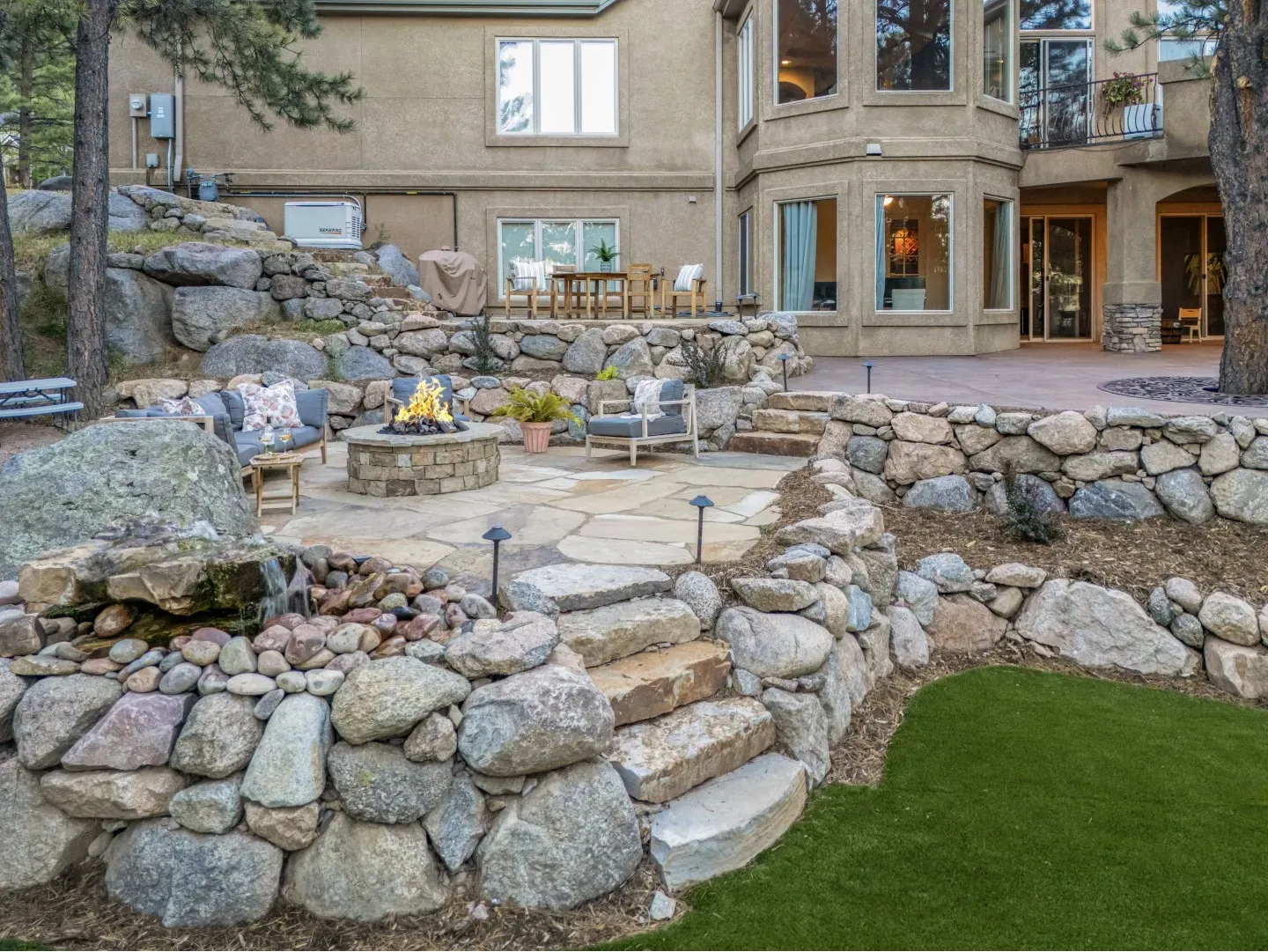 Extend the use of your outdoor space with a custom firepit or fireplace designed for gathering, warm 