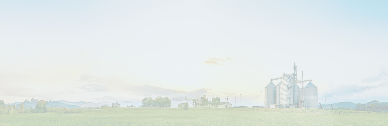 A serene scene of a farm at sunrise.