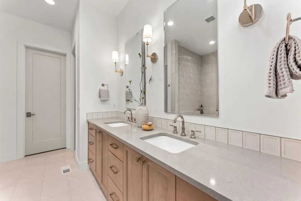 Spa-inspired bathroom, including a frameless walk-in shower, freestanding soaking tub, designer tile.