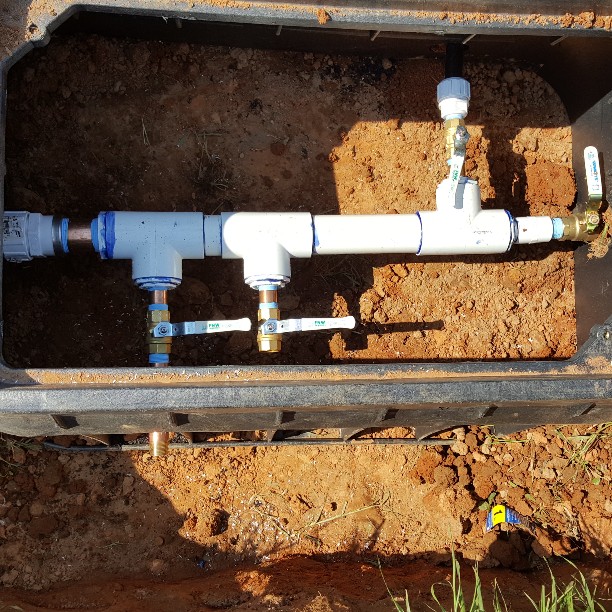 New multi valve water line. The valves on the bottom are for future options. the valve at the top is a yard hydrant. straight through for home.