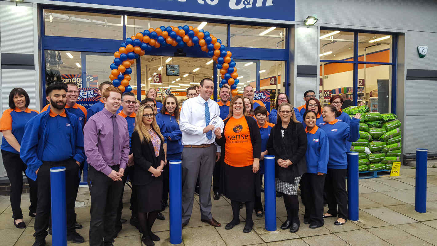 The new Crawley store and Representatives from Sense who gratefully received £250 worth of B&M vouchers.