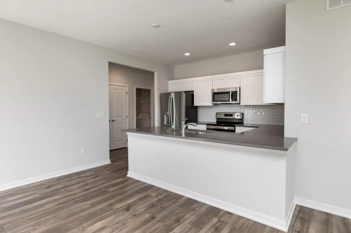 Kitchen with decorative light fixtures
