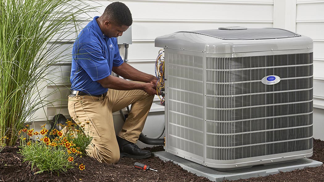 A Carrier dealer performs an HVAC installation