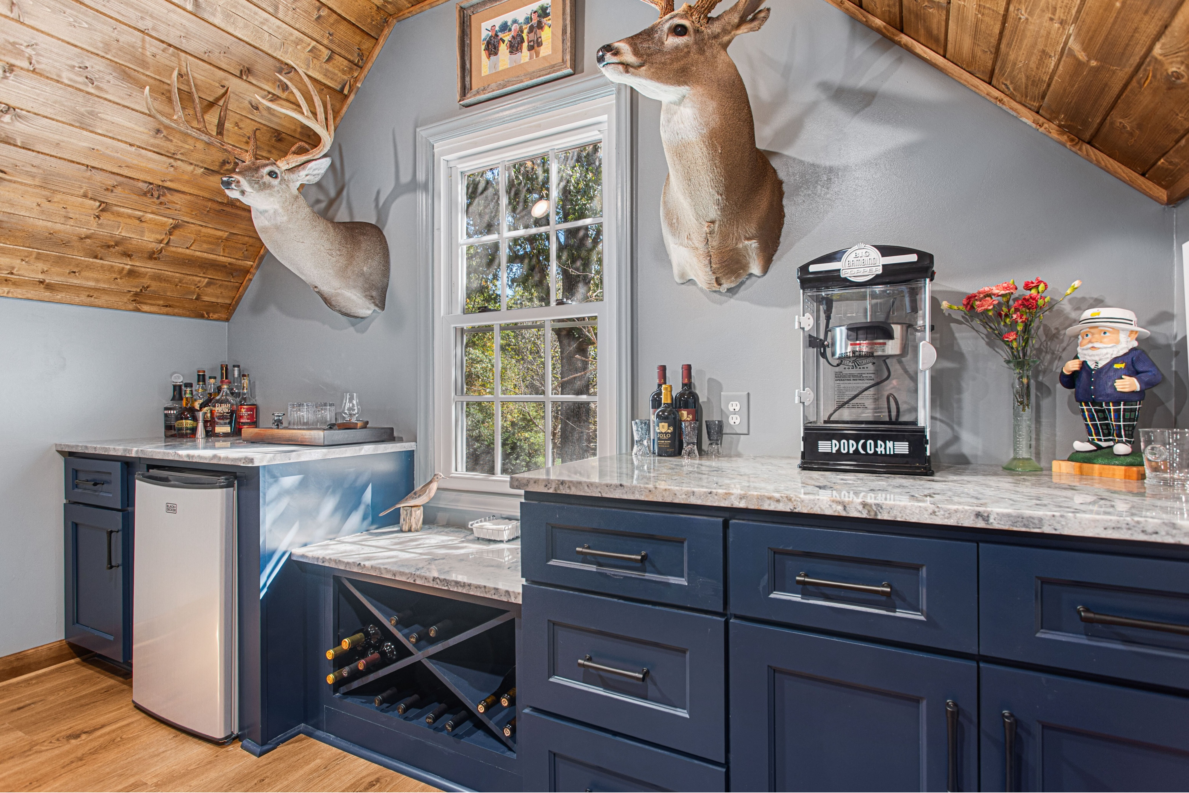 Custom wet bar and built-in cabinetry near Badin Lake, North Carolina featuring custom woodwork, stone countertops, and professional finish carpentry. This project reflects high-end interior remodeling and design-build expertise.