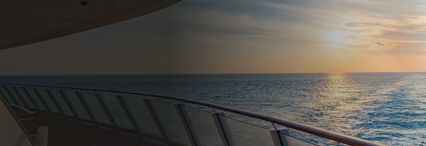A view of a calm body of water from a cruise ship deck.
