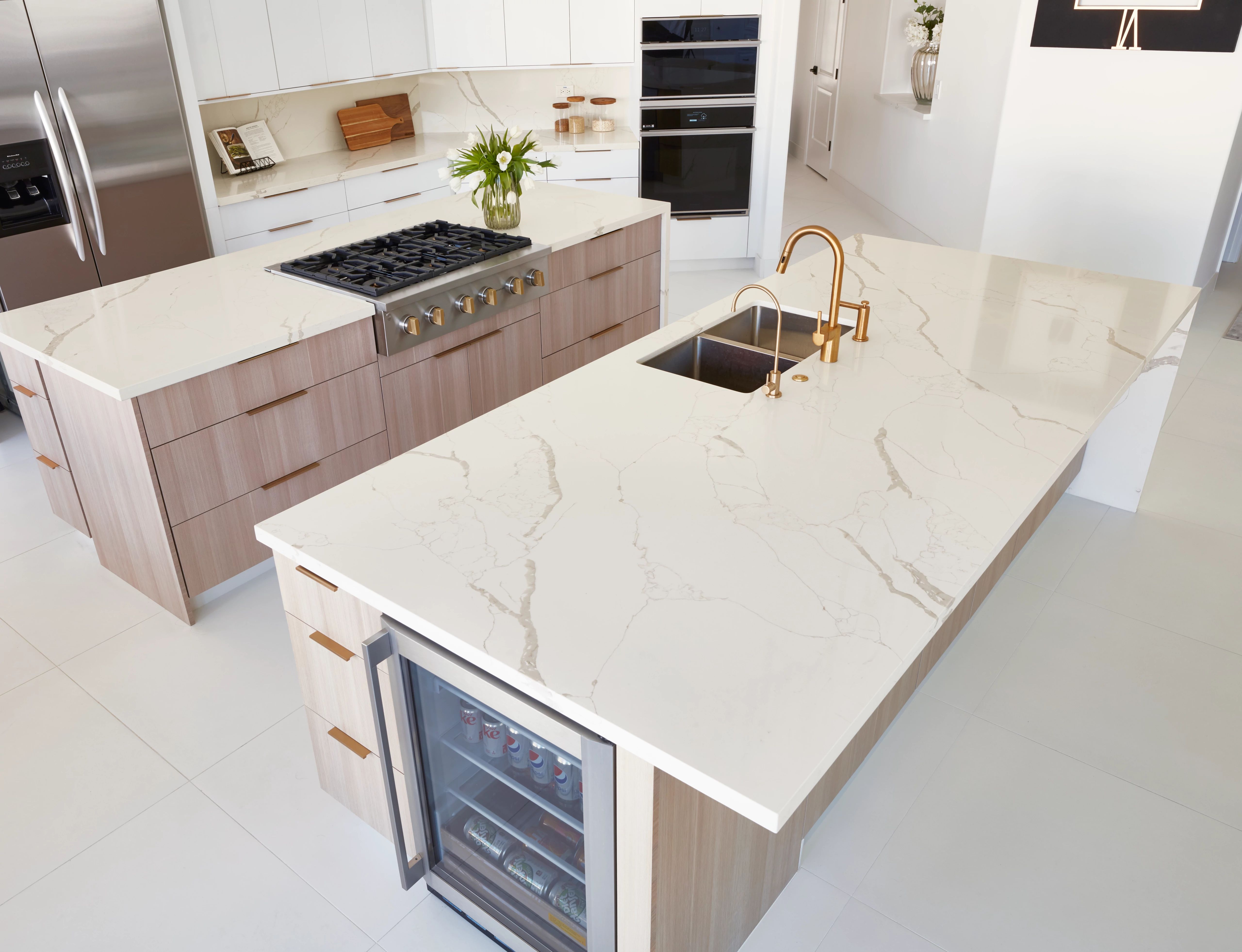Calacatta Capella is classic white quartz with grey, marble-like veining strewn throughout. This dramatic detail gives the material the look of natural stone and adds character to its clean and simple backdrop.